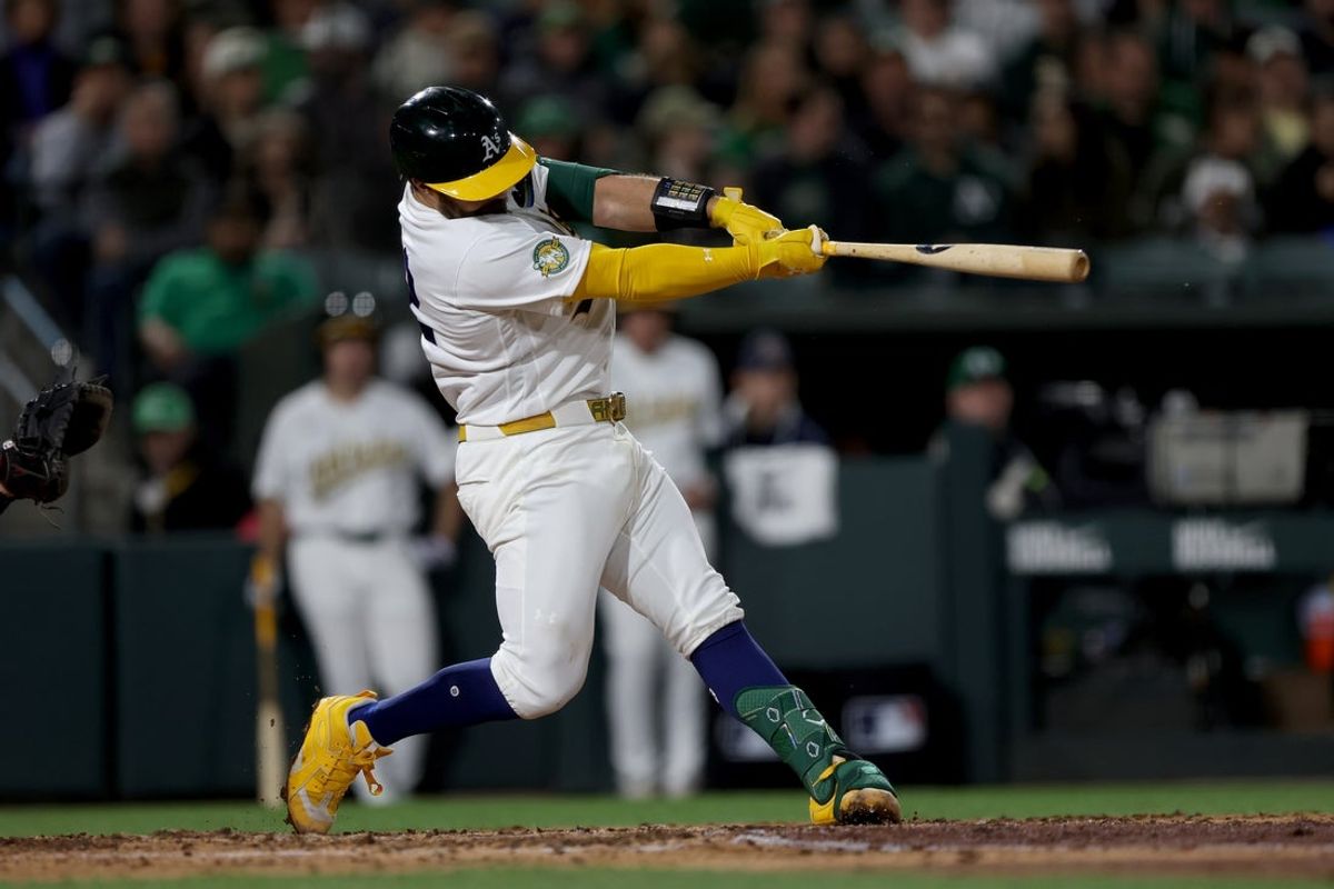Apr 15, 2026; West Sacramento, California, USA; Athletics catcher Shea Langeliers (23) hits a two-run home run against the Texas Rangers during the sixth inning at Sutter Health Park. Mandatory Credit: Dennis Lee-Imagn Images