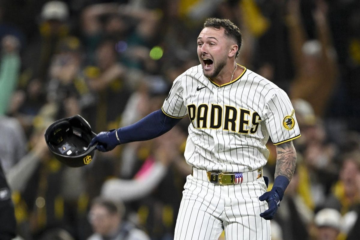 Apr 15, 2026; San Diego, California, USA; San Diego Padres center fielder Jackson Merrill celebrates after hitting a walk-off double during the ninth inning against the Seattle Mariners at Petco Park. All MLB players are wearing number 42 today to honor Jackie Robinson. Mandatory Credit: Denis Poroy-Imagn Images