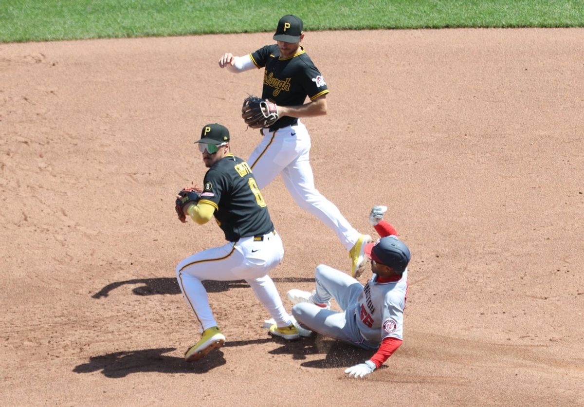 Apr 16, 2026; Pittsburgh, Pennsylvania, USA;  Washington Nationals second baseman Nasim Nuñez (26) slides into Pittsburgh Pirates shortstop Konnor Griffin (6) at second base forcing an error and allowing two runs to score during the fifth inning at PNC Park. Mandatory Credit: Charles LeClaire-Imagn Images