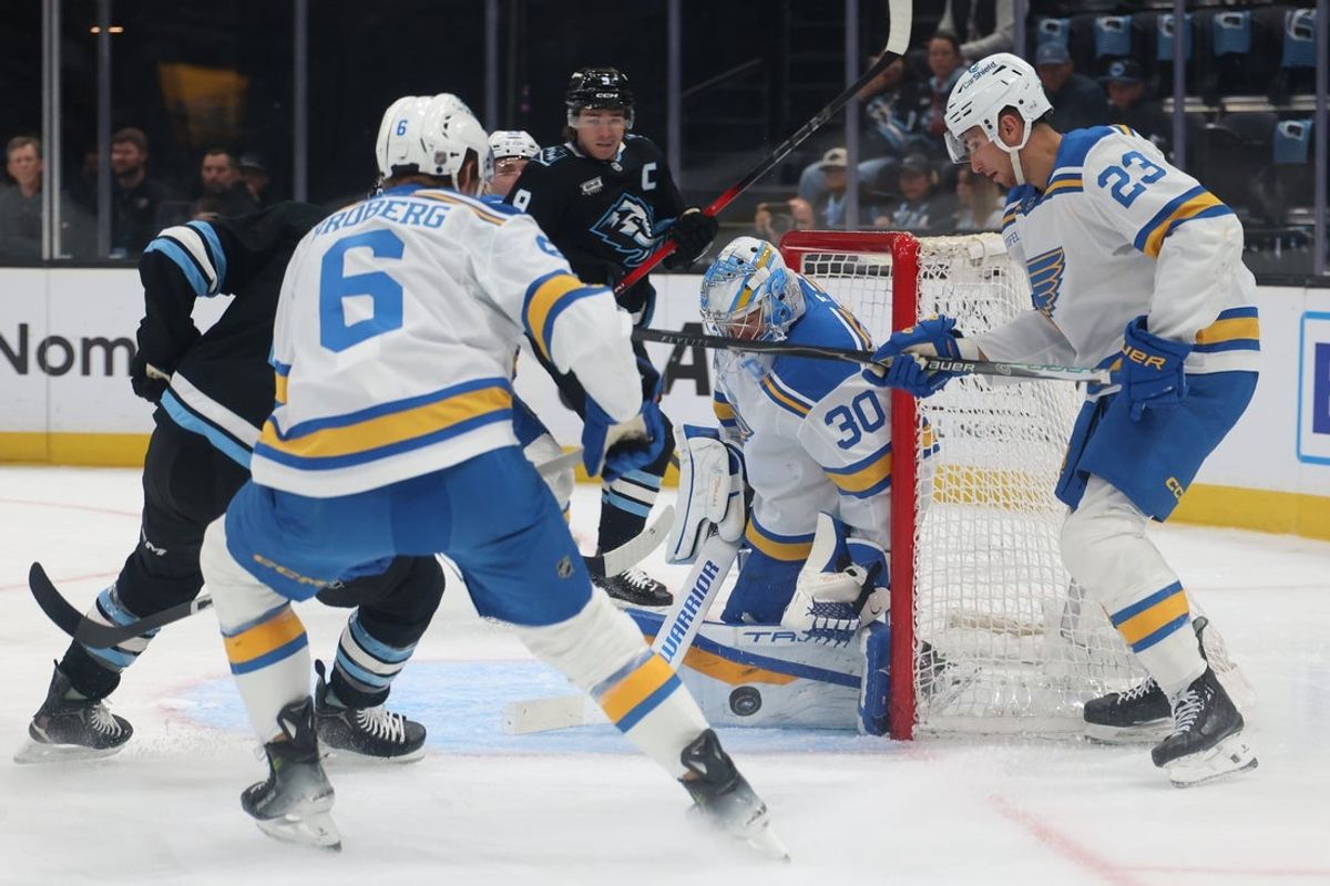 Apr 16, 2026; Salt Lake City, Utah, USA; St. Louis Blues goaltender Joel Hofer (30) blocks a shot by the Utah Mammoth during the first period at Delta Center. Mandatory Credit: Rob Gray-Imagn Images