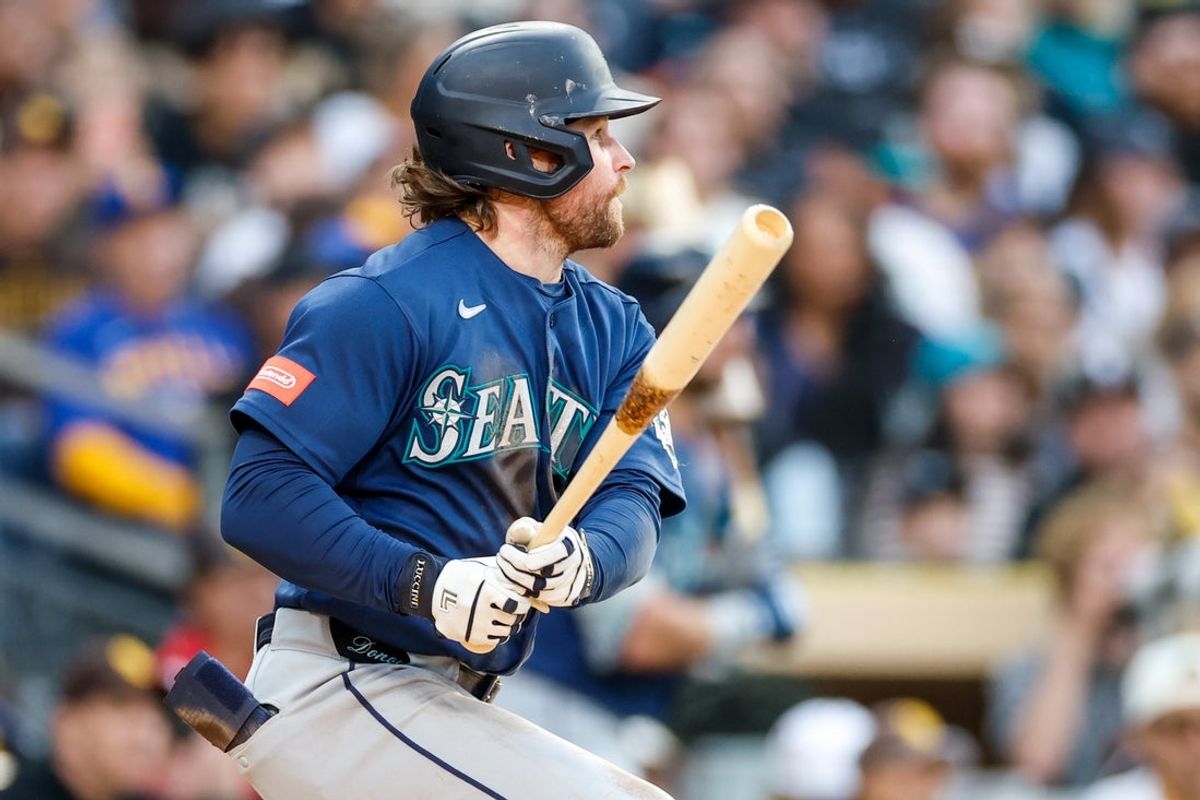 Apr 16, 2026; San Diego, California, USA; Seattle Mariners third baseman Brendan Donovan (33) hits a single during the fourth inning against the San Diego Padres at Petco Park. Mandatory Credit: David Frerker-Imagn Images