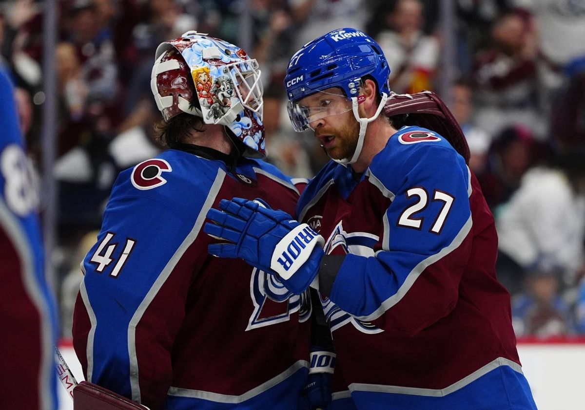 Apr 16, 2026; Denver, Colorado, USA; Colorado Avalanche goaltender Scott Wedgewood (41) and defenseman Brett Kulak (27) celebrate defeating the Seattle Kraken at Ball Arena. Mandatory Credit: Ron Chenoy-Imagn Images