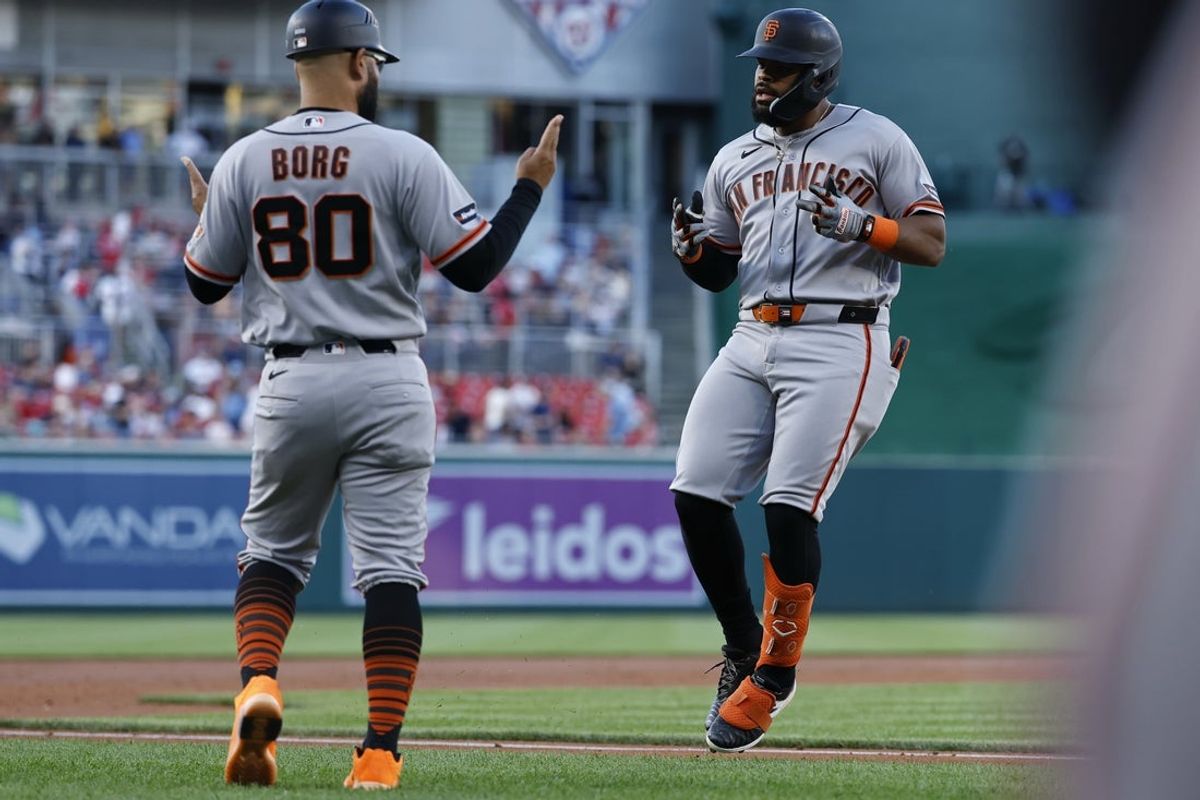 Apr 17, 2026; Washington, District of Columbia, USA; San Francisco Giants left fielder Heliot Ramos (17) celebrates with Giants third base coach Hector Borg (80) while rounding the bases after hitting a three run home run against the Washington Nationals during the second inning at Nationals Park. Mandatory Credit: Geoff Burke-Imagn Images
