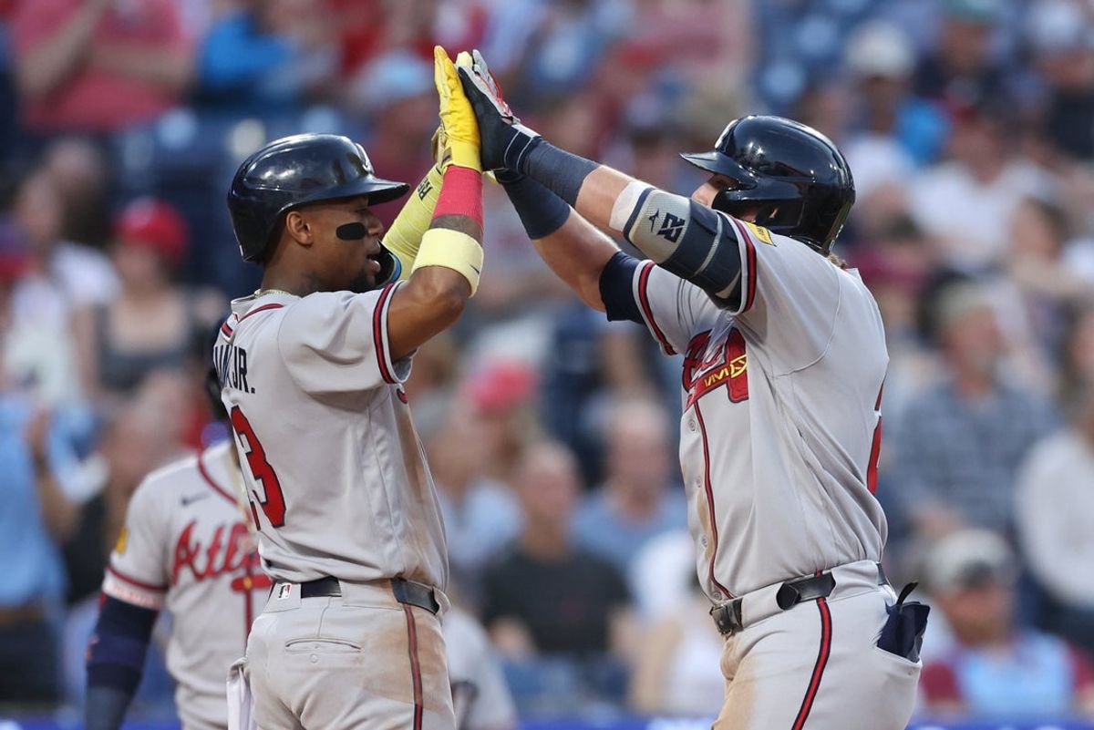 Apr 17, 2026; Philadelphia, Pennsylvania, USA; Atlanta Braves third baseman Austin Riley (27) high fives right fielder Ronald Acuna Jr. (13) after hitting a three RBI home run against the Philadelphia Phillies during the second inning at Citizens Bank Park. Mandatory Credit: Bill Streicher-Imagn Images