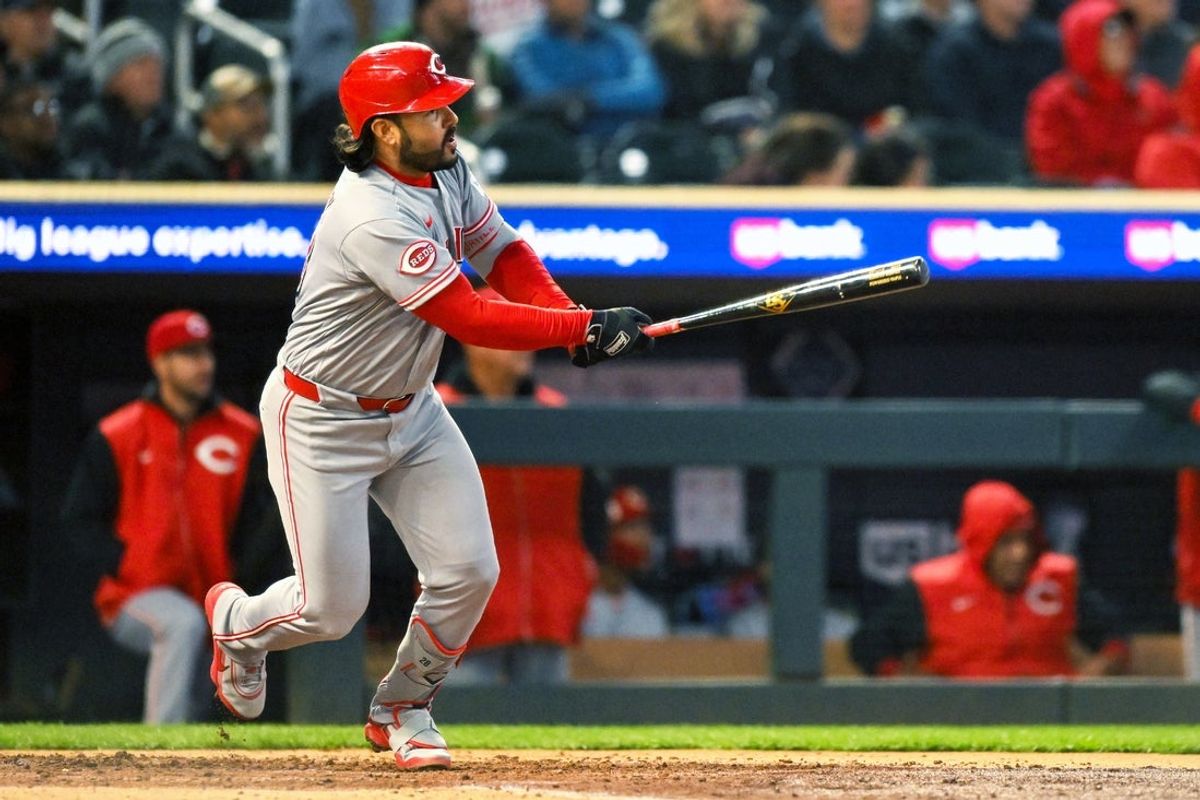 Apr 17, 2026; Minneapolis, Minnesota, USA; Cincinnati Reds third baseman Eugenio Suarez (28) hits a double in the fourth inning against the Minnesota Twins at Target Field. Mandatory Credit: Nick Wosika-Imagn Images