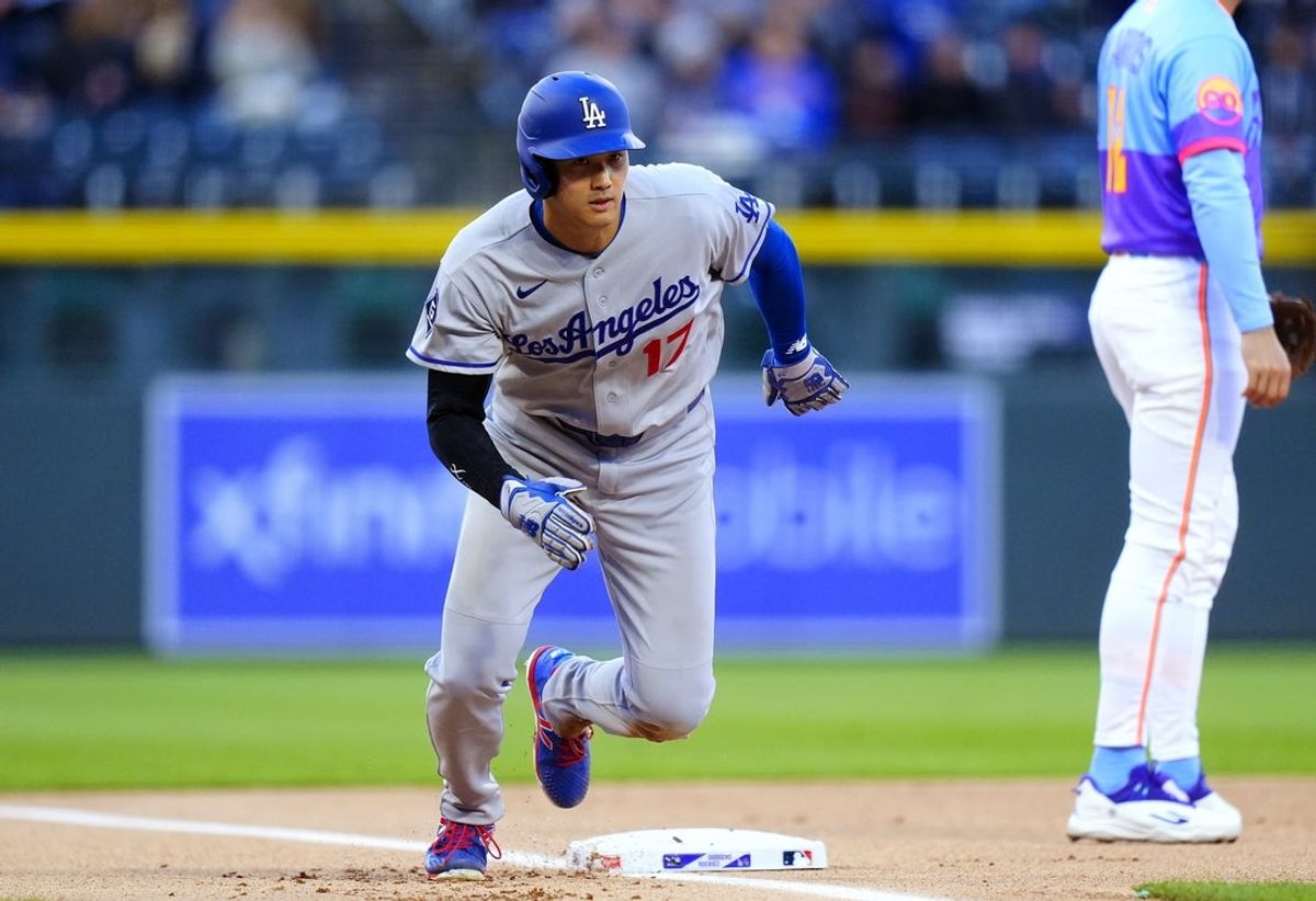 Apr 17, 2026; Denver, Colorado, USA; Los Angeles Dodgers designated hitter Shohei Ohtani (17) leaves third base to score a run in the first inning against the Colorado Rockies at Coors Field. Mandatory Credit: Ron Chenoy-Imagn Images