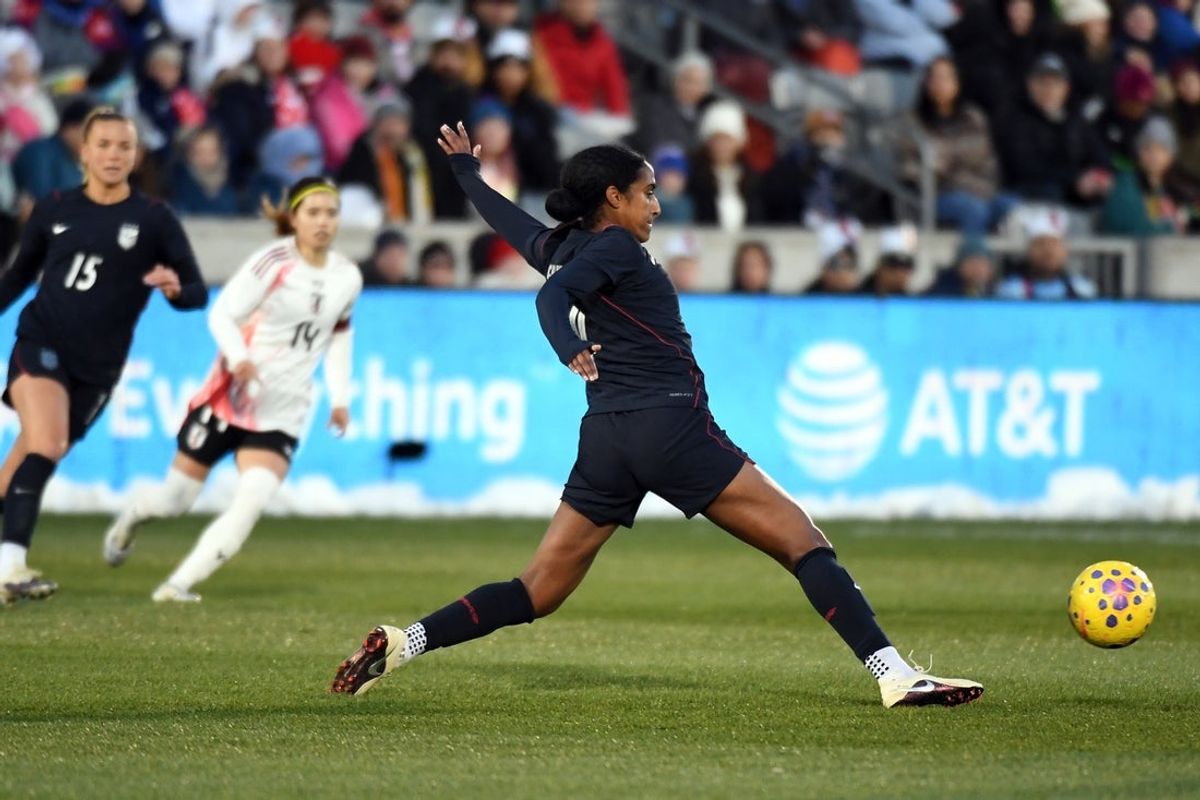 Apr 17, 2026; Commerce City, CO, USA; United States defender Naomi Girma (4) kicks the ball in the middle of the field during the first half against Japan at DICK'S Sporting Goods Park. Mandatory Credit: Christopher Hanewinckel-Imagn Images