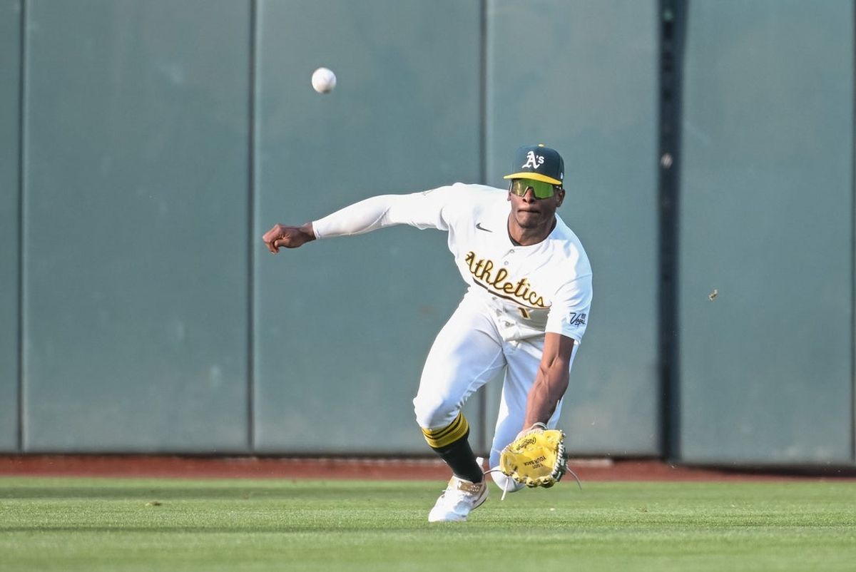 Apr 17, 2026; West Sacramento, California, USA; Athletics center fielder Denzel Clarke (1) attempts to catch the ball during the first inning of the game against the Chicago White Sox at Sutter Health Park. Mandatory Credit: Ed Szczepanski-Imagn Images