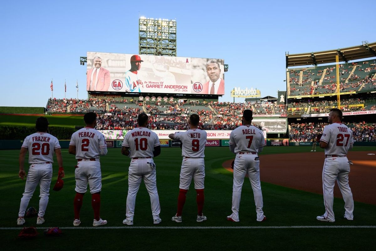 Apr 17, 2026; Anaheim, California, USA; Los Angeles Angels players take a moment of silence to honor former player Garret Anderson before a game against the San Diego Padres at Angel Stadium. Mandatory Credit: William Liang-Imagn Images
