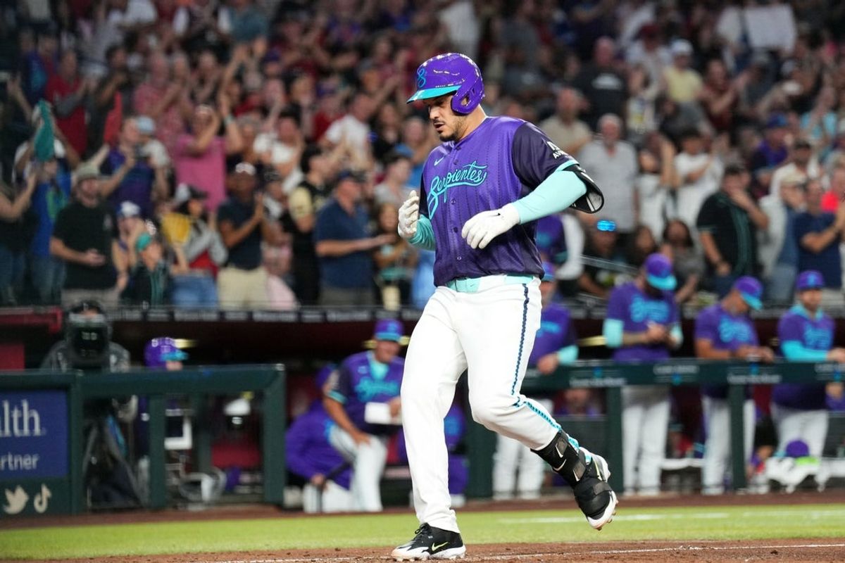 Apr 17, 2026; Phoenix, Arizona, USA; Arizona Diamondbacks third baseman Nolan Arenado (28) crosses home plate after hitting a solo home run against the Toronto Blue Jays during the fourth inning at Chase Field. Mandatory Credit: Joe Camporeale-Imagn Images