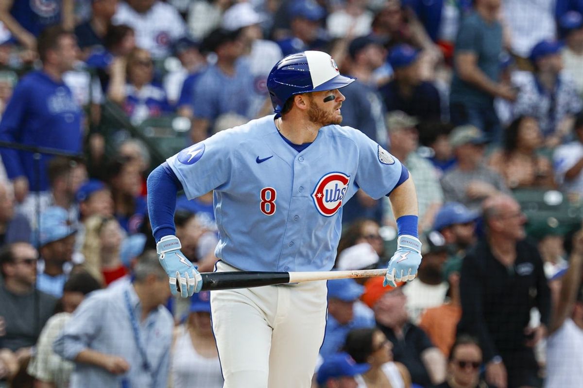 Apr 17, 2026; Chicago, Illinois, USA; Chicago Cubs left fielder Ian Happ (8) watches his two-run home run against the New York Mets during the eight inning at Wrigley Field. Mandatory Credit: Kamil Krzaczynski-Imagn Images