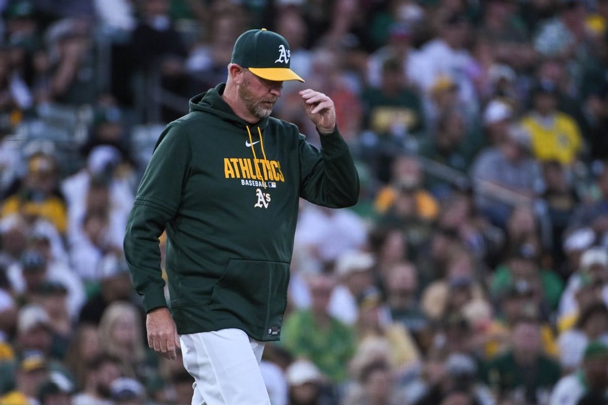 Apr 17, 2026; West Sacramento, California, USA; Athletics pitching coach Scott Emerson (14) visits the mound during the third inning of the game against the Chicago White Sox at Sutter Health Park. Mandatory Credit: Ed Szczepanski-Imagn Images