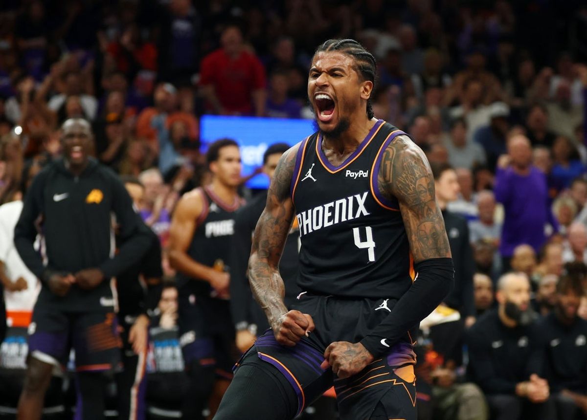 Apr 17, 2026; Phoenix, Arizona, USA; Phoenix Suns guard Jalen Green (4) celebrates after a slam dunk against the Golden State Warriors during the first half in the play-in rounds of the 2026 NBA Playoffs at Mortgage Matchup Center. Mandatory Credit: Mark J. Rebilas-Imagn Images