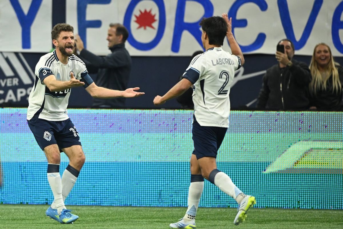 Apr 17, 2026; Vancouver, British Columbia, CAN;  Vancouver Whitecaps FC midfielder Thomas Muller (13) celebrates scoring with defender Mathias Laborda (2) during the first half against the Sporting Kansas City at BC Place. Mandatory Credit: Anne-Marie Sorvin-Imagn Images