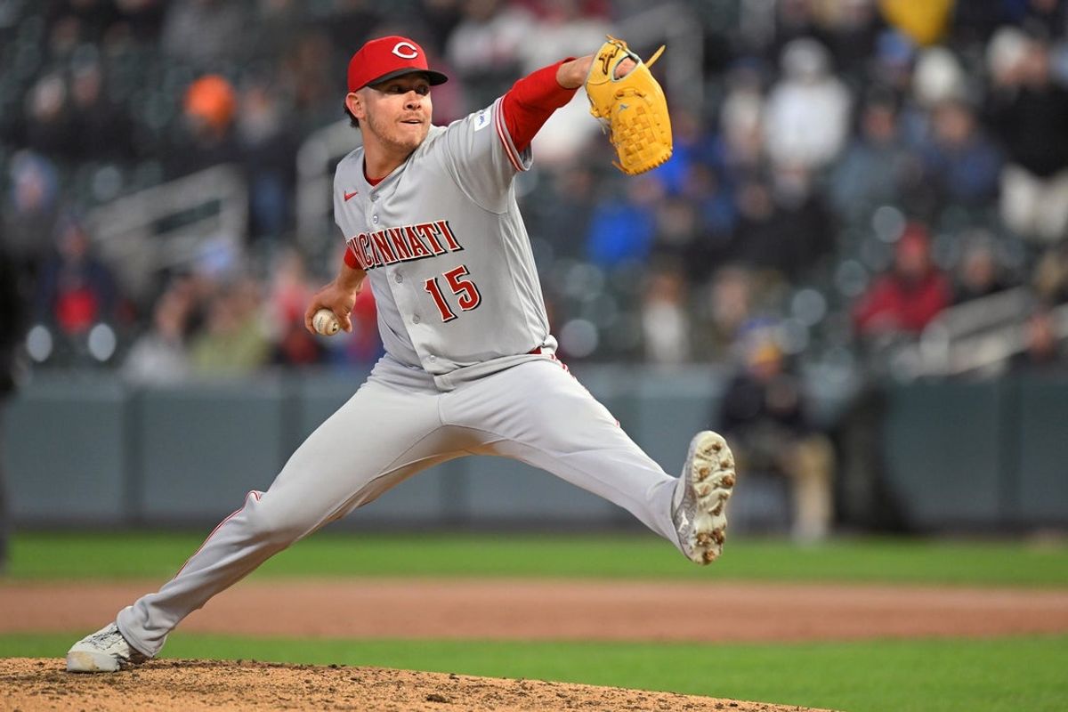 Apr 17, 2026; Minneapolis, Minnesota, USA;  Cincinnati Reds relief pitcher Emilio Pagan (15) delivers a pitch against the Minnesota Twins during the ninth inning inning at Target Field. Mandatory Credit: Nick Wosika-Imagn Images