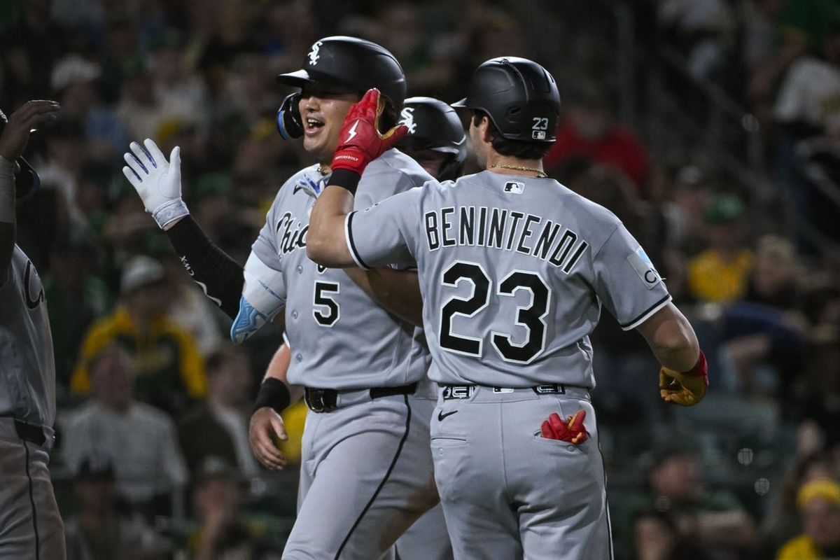 Apr 17, 2026; West Sacramento, California, USA; Chicago White Sox third baseman Munetaka Murakami (5) celebrates with left fielder Andrew Benintendi (23) after hitting a grand slam against the Athletics during the seventh inning at Sutter Health Park. Mandatory Credit: Ed Szczepanski-Imagn Images