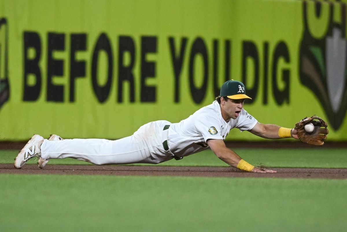 Apr 17, 2026; West Sacramento, California, USA; Athletics third baseman Max Muncy (3) dives for the ball during the sixth inning of the game against the Chicago White Sox at Sutter Health Park. Mandatory Credit: Ed Szczepanski-Imagn Images