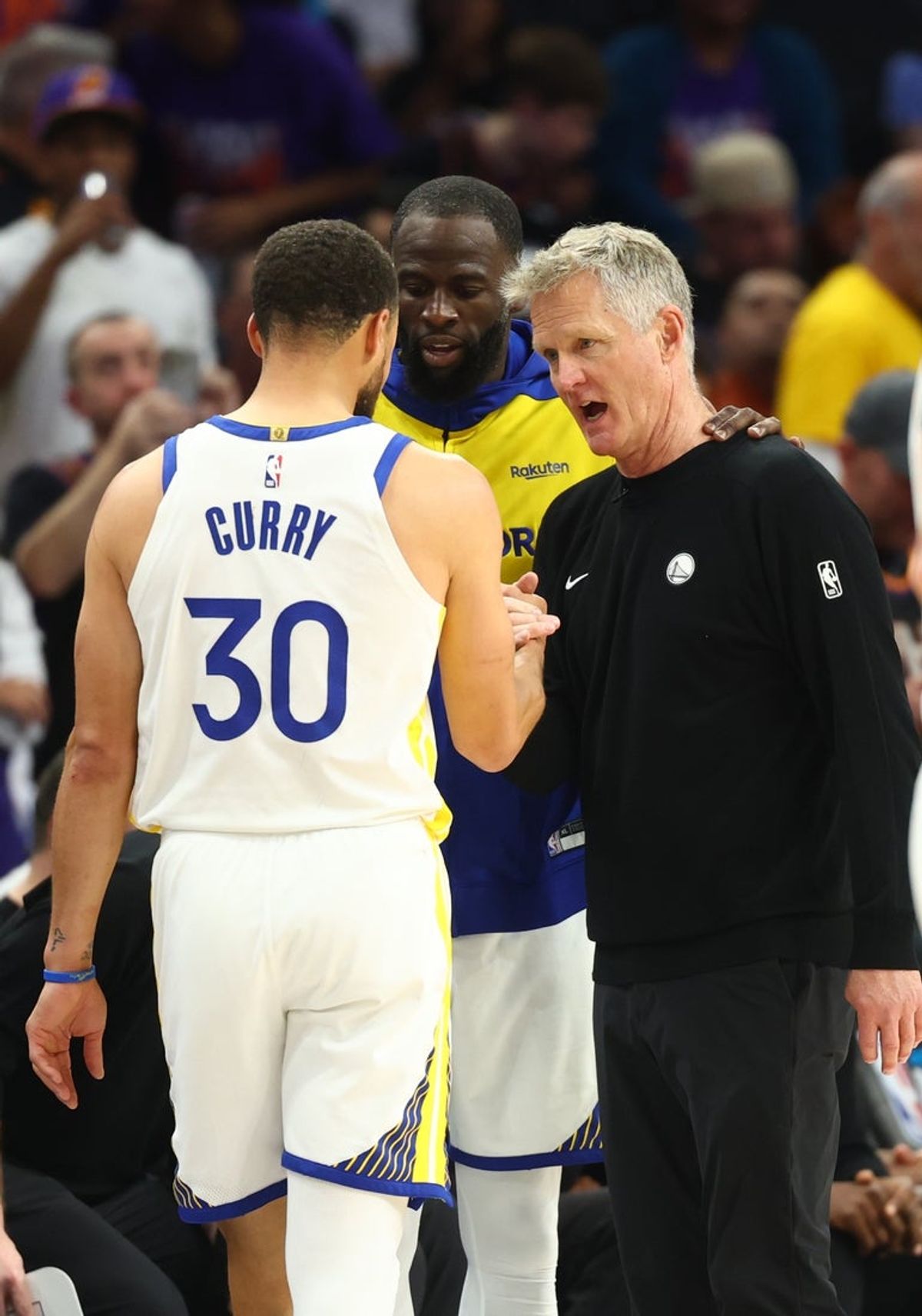 Apr 17, 2026; Phoenix, Arizona, USA; Golden State Warriors guard Stephen Curry (30) with forward Draymond Green and head coach Steve Kerr against the Phoenix Suns during the closing seconds of the play-in rounds of the 2026 NBA Playoffs at Mortgage Matchup Center. Mandatory Credit: Mark J. Rebilas-Imagn Images