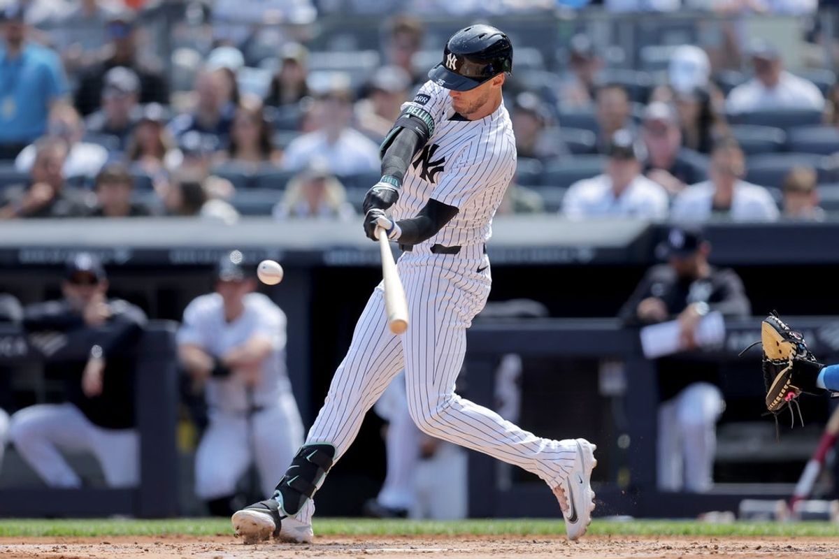 Apr 18, 2026; Bronx, New York, USA; New York Yankees center fielder Cody Bellinger (35) hits a two run home run against the Kansas City Royals during the third inning at Yankee Stadium. Mandatory Credit: Brad Penner-Imagn Images