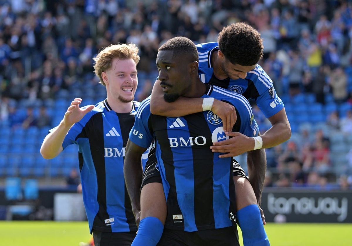 Apr 18, 2026; Montreal, Province of Quebec, CAN; CF Montreal forward Prince Owusu (9) celebrates with teammates including defenseman Dawid Bugaj (27) and midfielder Noah Streit (23) after scoring a goal against the Red Bull New York during the first half at Saputo Stadium. Mandatory Credit: Eric Bolte-Imagn Images