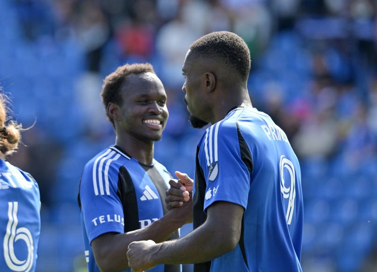 Apr 18, 2026; Montreal, Province of Quebec, CAN; CF Montreal forward Prince Owusu (9) celebrates with teammate midfielder Victor Loturi (22) after scoring a goal against the Red Bull New York during the first half at Saputo Stadium. Mandatory Credit: Eric Bolte-Imagn Images
