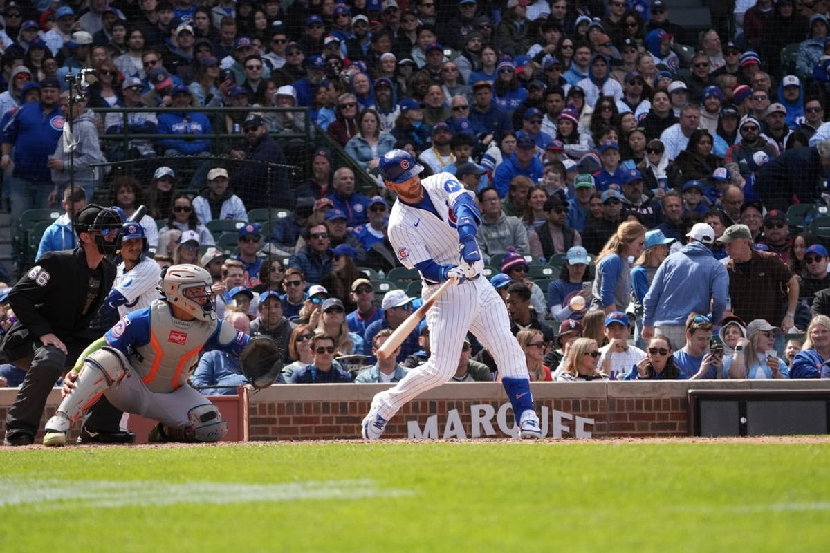 Apr 18, 2026; Chicago, Illinois, USA; Chicago Cubs pinch-hitter Carson Kelly (15)  hits a three-run homer against the New York Mets during the sixth inning at Wrigley Field. Mandatory Credit: David Banks-Imagn Images