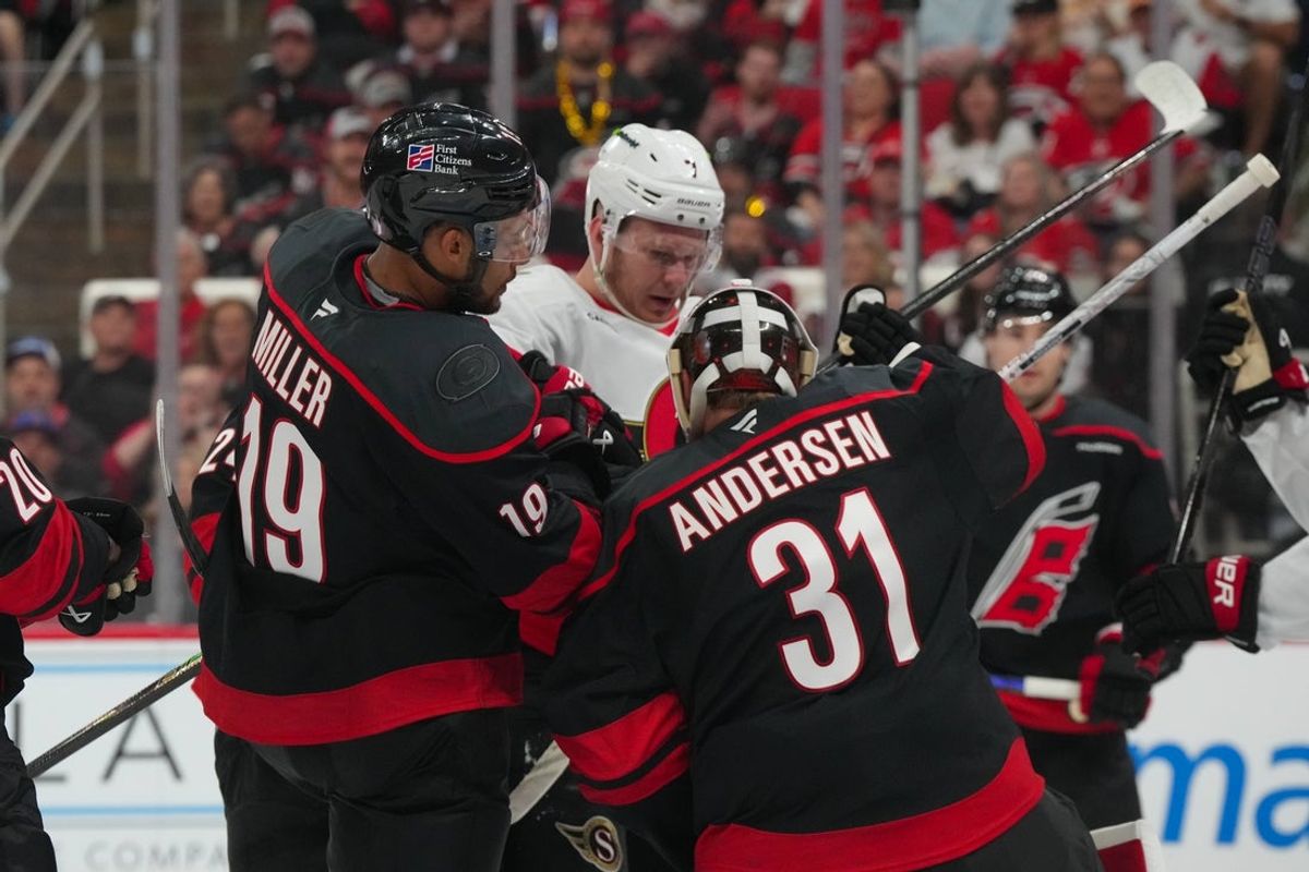 Apr 18, 2026; Raleigh, North Carolina, USA; Ottawa Senators left wing Brady Tkachuk (7) battles against Carolina Hurricanes defenseman K'andre Miller (19) and goaltender Frederik Andersen (31) during the second period in game one of the first round of the 2026 Stanley Cup Playoffs at Lenovo Center. Mandatory Credit: James Guillory-Imagn Images