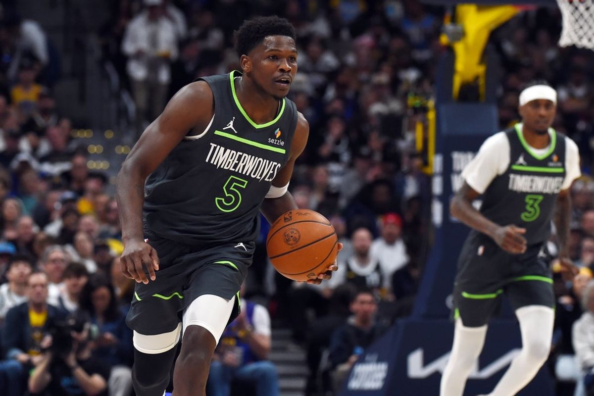 Apr 18, 2026; Denver, Colorado, USA; Minnesota Timberwolves guard Anthony Edwards (5) dribbles the ball up the court during the first half against the Denver Nuggets in game one of the first round of the 2026 NBA Playoffs at Ball Arena. Mandatory Credit: Christopher Hanewinckel-Imagn Images