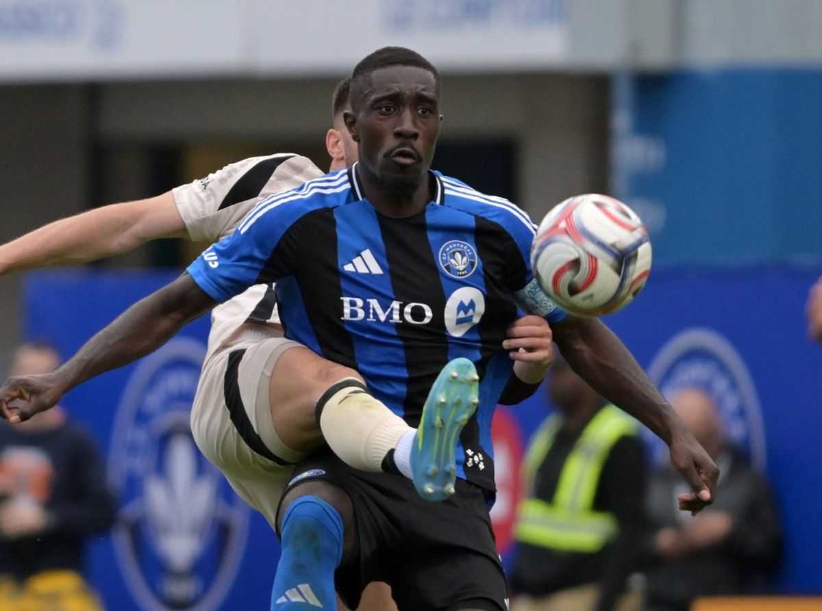 Apr 18, 2026; Montreal, Province of Quebec, CAN; Red Bull New York defenseman Dylan Nealis (12) defends against CF Montreal forward Prince Owusu (9) during the second half at Saputo Stadium. Mandatory Credit: Eric Bolte-Imagn Images