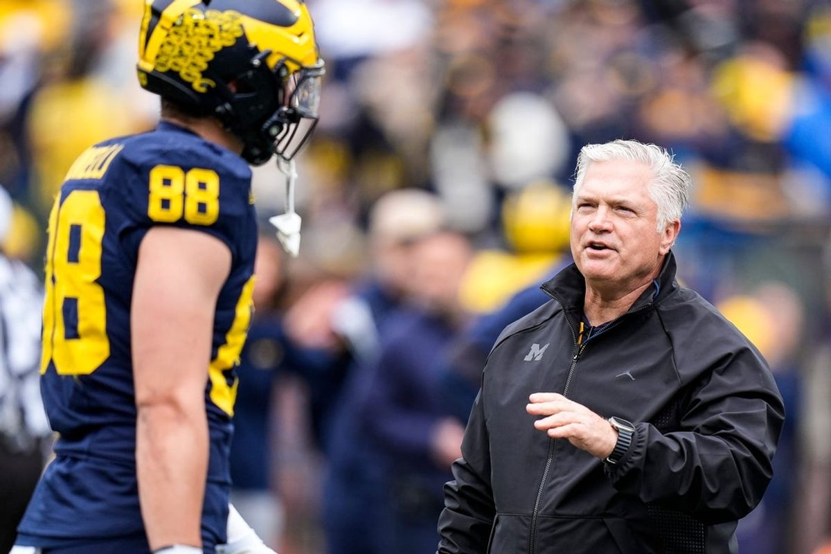 Michigan tight ends coach Freddie Whittingham, right, talks to tight end Deakon Tonielli (88) before the spring game at Michigan Stadium in Ann Arbor on Saturday, April 18, 2026.