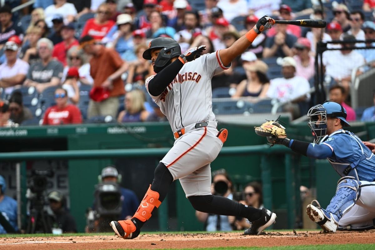 Apr 18, 2026; Washington, District of Columbia, USA; San Francisco Giants left fielder Heliot Ramos (17) hits a double against the Washington Nationals during the second inning at Nationals Park. Mandatory Credit: Brad Mills-Imagn Images