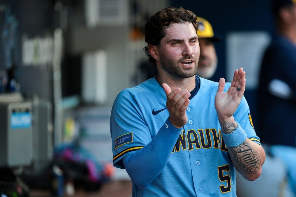 Apr 18, 2026; Miami, Florida, USA; Milwaukee Brewers center fielder Garrett Mitchell (5) celebrates after scoring against the Miami Marlins during the sixth inning at loanDepot Park. Mandatory Credit: Sam Navarro-Imagn Images