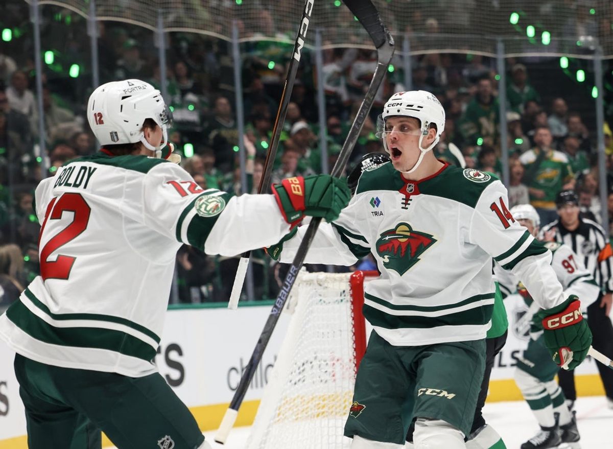 Apr 18, 2026; Dallas, Texas, USA; Minnesota Wild left wing Matt Boldy (12) celebrates center Joel Eriksson Ek (14) gaol against there Dallas Stars in the first period in game one of the first round of the 2026 Stanley Cup Playoffs at American Airlines Center. Mandatory Credit: Thomas Shea-Imagn Images