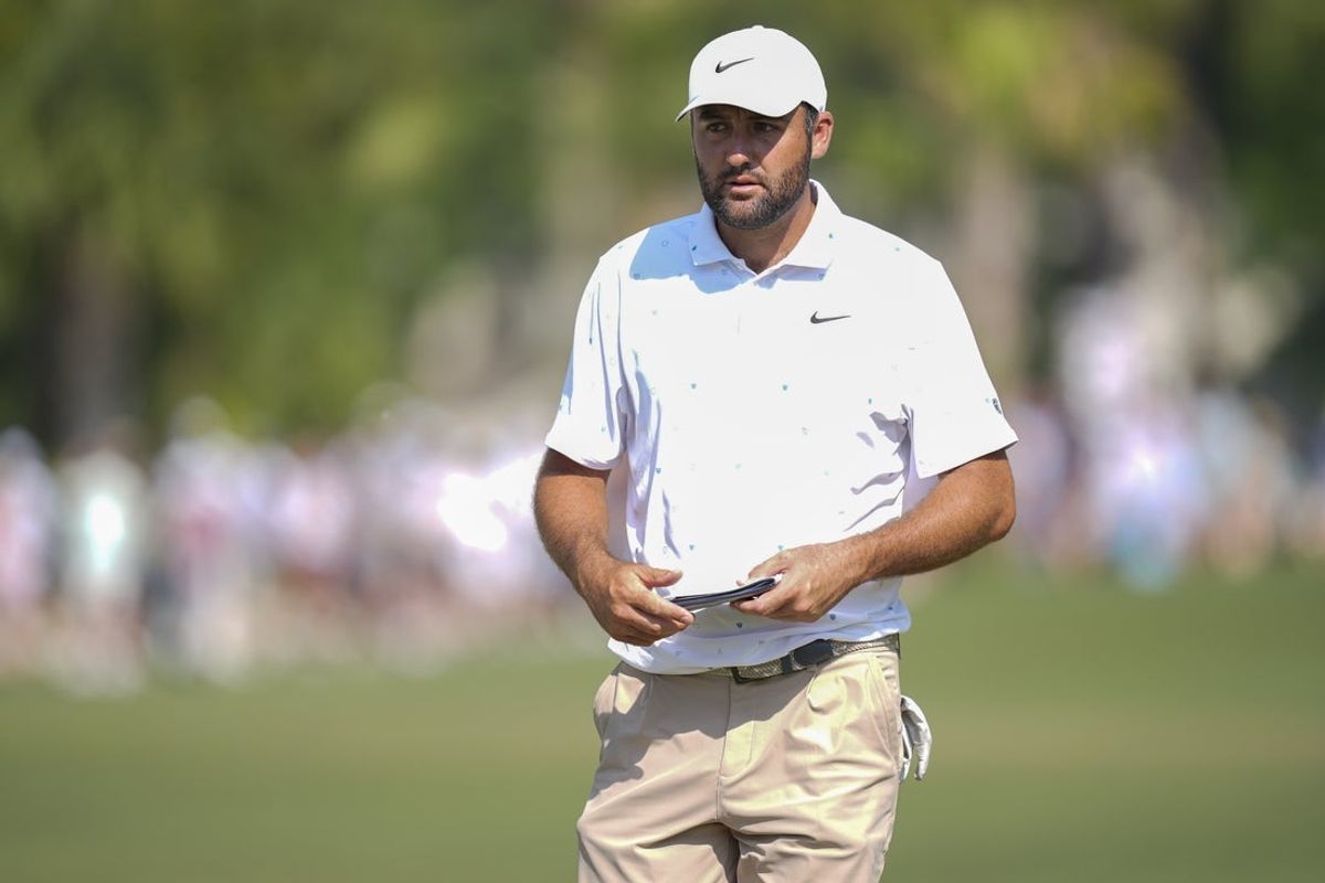 Apr 18, 2026; Hilton Head, South Carolina, USA; Scottie Scheffler with his scorecard on 16 during the third round of the RBC Heritage golf tournament. Mandatory Credit: Jim Dedmon-Imagn Images