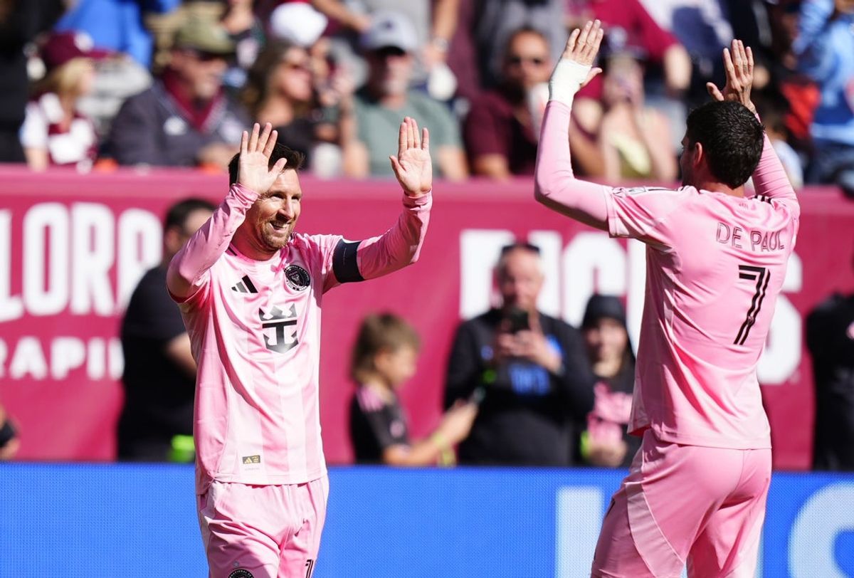 Apr 18, 2026; Denver, Colorado, USA; Inter Miami CF forward Lionel Messi (10) celebrates his game winning goal midfielder Rodrigo de Paul (7) in the second half against the Inter Miami CF at Empower Field at Mile High. Mandatory Credit: Ron Chenoy-Imagn Images