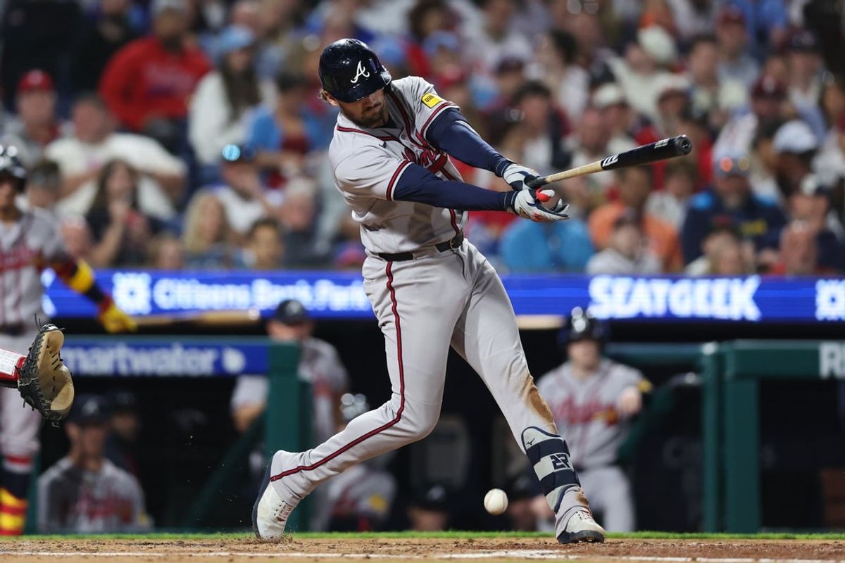 Apr 18, 2026; Philadelphia, Pennsylvania, USA; Atlanta Braves third baseman Austin Riley (27) hits an RBI single against the Philadelphia Phillies during the third inning at Citizens Bank Park. Mandatory Credit: Bill Streicher-Imagn Images