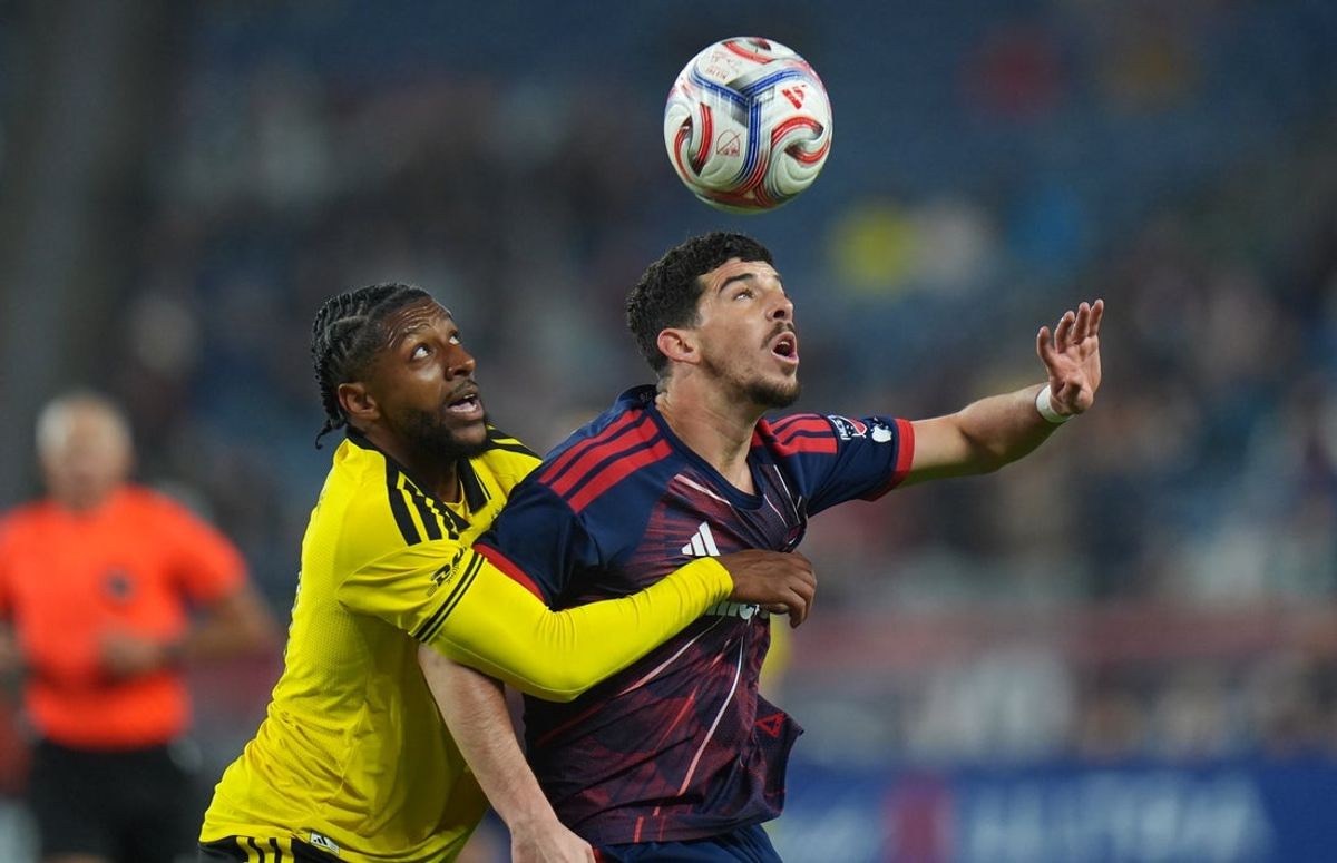 Apr 18, 2026; Foxborough, Massachusetts, USA; Columbus Crew defender Steven Moreira (31) and New England Revolution forward Dor Turgeman (11) work for the ball in the first half at Gillette Stadium. Mandatory Credit: David Butler II-Imagn Images