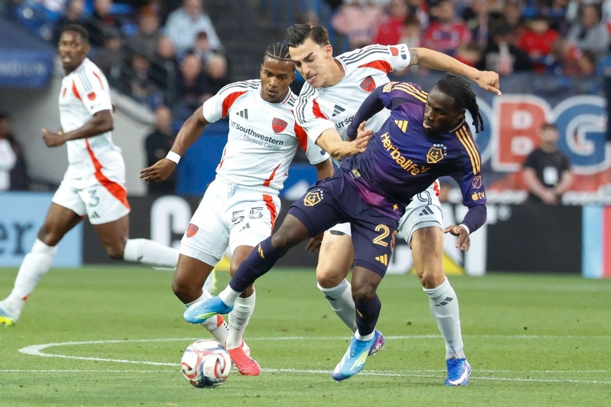 Apr 18, 2026; Frisco, Texas, USA; LA Galaxy forward Joseph Paintsil (28) dribbles the ball as FC Dallas forward Petar Musa (9) defends during the first half at Toyota Stadium. Mandatory Credit: Chris Jones-Imagn Images