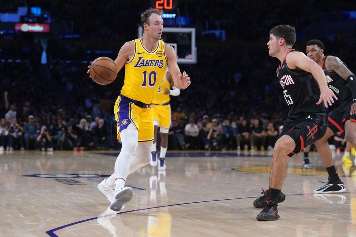 Apr 18, 2026; Los Angeles, California, USA; Los Angeles Lakers guard Luke Kennard (10) dribbles the ball against Houston Rockets guard Reed Sheppard (15) in the first half during game one of the first round of the 2026 NBA Playoffs at Crypto.com Arena. Mandatory Credit: Kirby Lee-Imagn Images