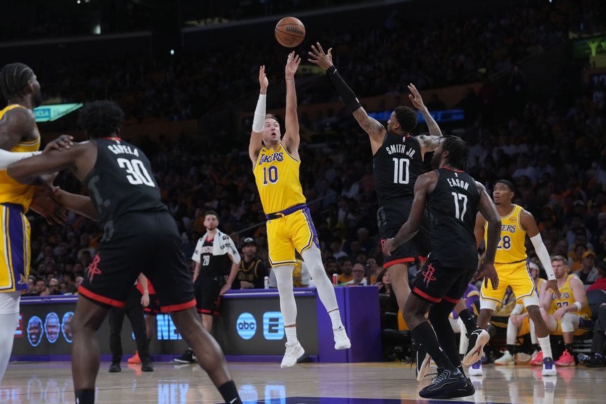Apr 18, 2026; Los Angeles, California, USA; Los Angeles Lakers guard Luke Kennard (10) shoots the ball against Houston Rockets forward Jabari Smith Jr. (10) in the first half during game one of the first round of the 2026 NBA Playoffs at Crypto.com Arena. Mandatory Credit: Kirby Lee-Imagn Images