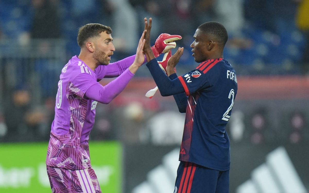 Apr 18, 2026; Foxborough, Massachusetts, USA; New England Revolution goalkeeper Matt Turner (30) reacts with  defender Mamadou Fofana (2) after defeating the Columbus Crew at Gillette Stadium. Mandatory Credit: David Butler II-Imagn Images