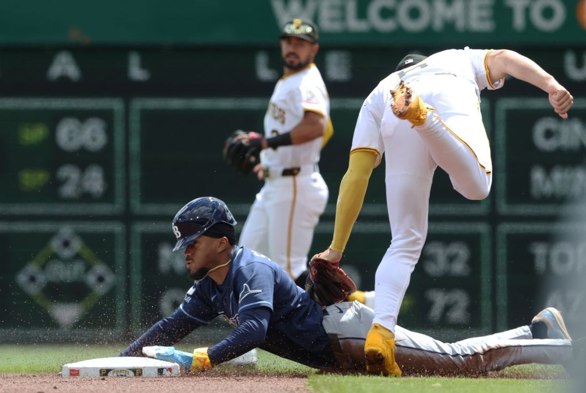 Apr 19, 2026; Pittsburgh, Pennsylvania, USA;  Pittsburgh Pirates shortstop Konnor Griffin (6) tags Tampa Bay Rays left fielder Chandler Simpson (14) out at second base on a steal attempt during the first inning at PNC Park. Mandatory Credit: Charles LeClaire-Imagn Images