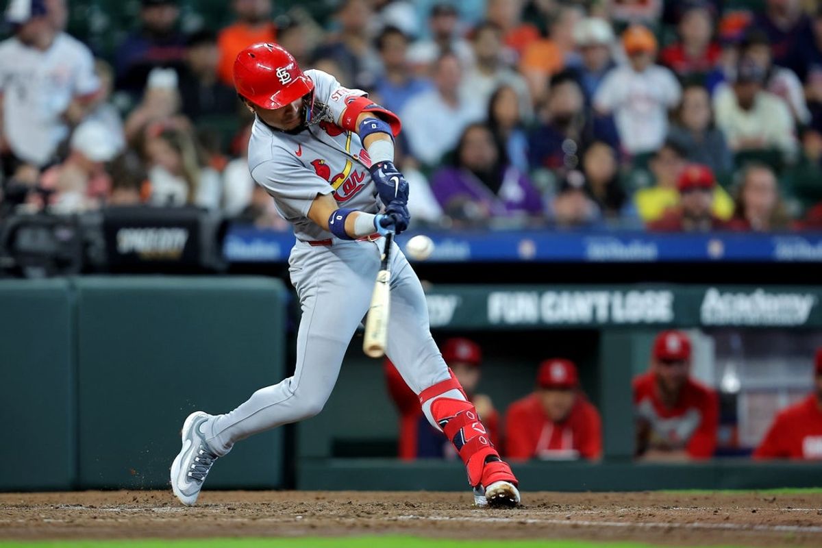 Apr 19, 2026; Houston, Texas, USA; St. Louis Cardinals shortstop Masyn Winn (0) hits a single against the Houston Astros during the sixth inning at Daikin Park. Mandatory Credit: Erik Williams-Imagn Images