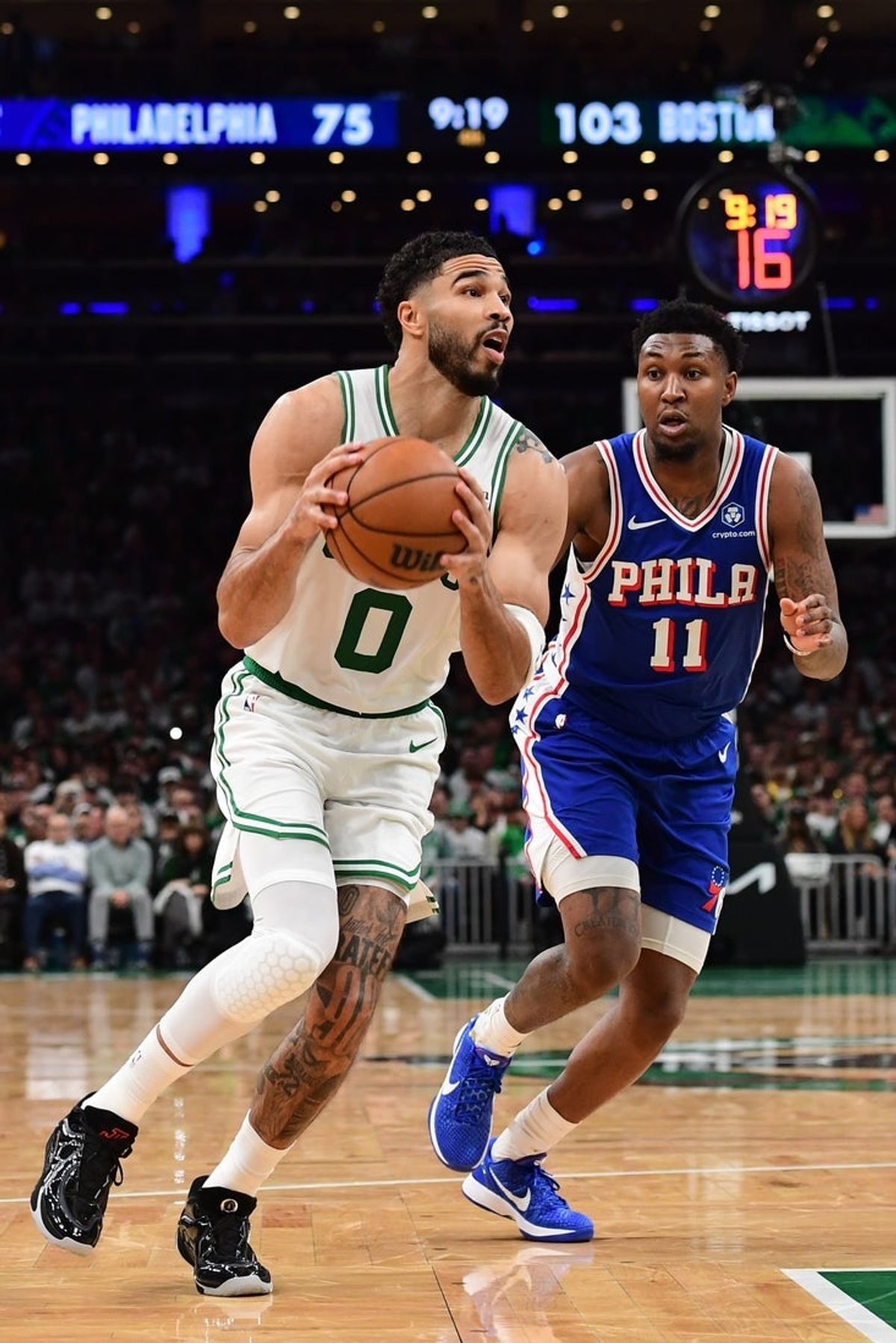 Apr 19, 2026; Boston, Massachusetts, USA; Boston Celtics forward Jayson Tatum (0) controls the ball ahead of Philadelphia 76ers forward Justin Edwards (11) in the second half during game one of the first round of the 2026 NBA Playoffs at TD Garden. Mandatory Credit: Bob DeChiara-Imagn Images