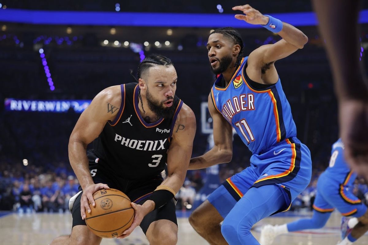 Apr 19, 2026; Oklahoma City, Oklahoma, USA; Phoenix Suns forward Dillon Brooks (3) is defended by Oklahoma City Thunder guard Isaiah Joe (11) on a drive to the basket in the second quarter during game one of the first round of the 2026 NBA Playoffs at Paycom Center. Mandatory Credit: Alonzo Adams-Imagn Images