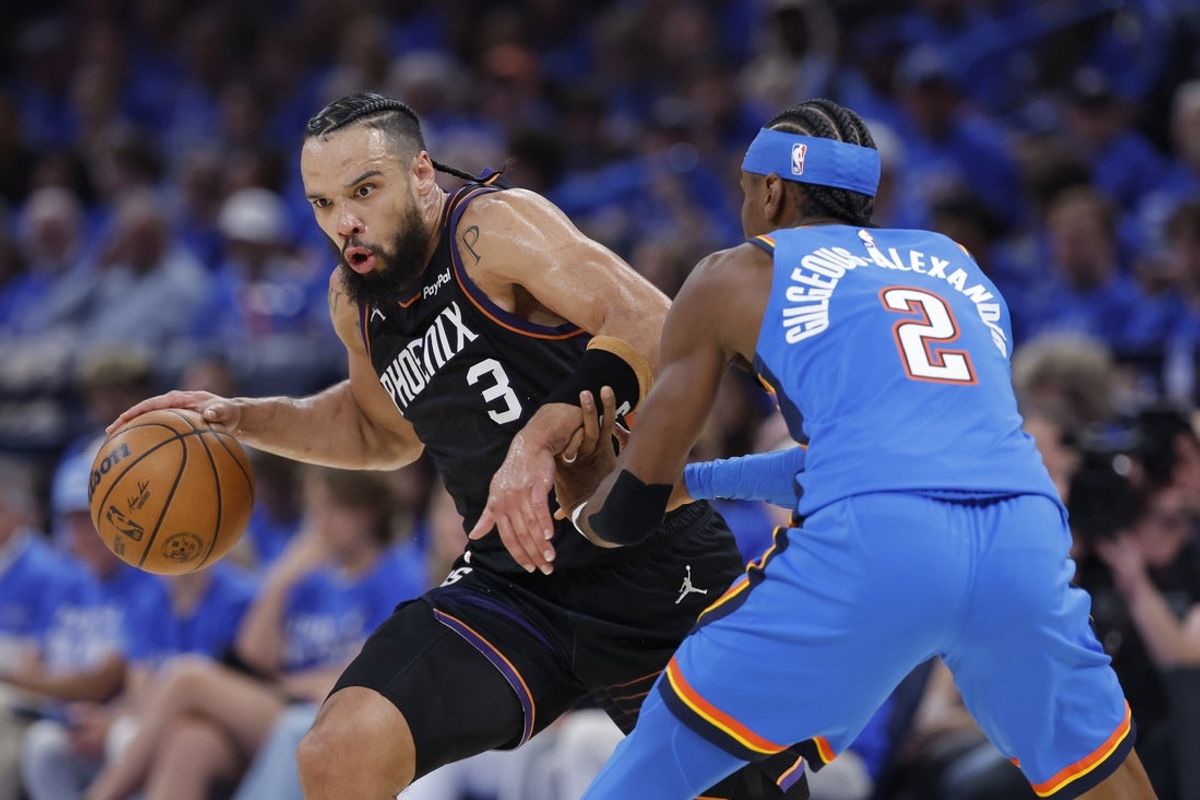 Apr 19, 2026; Oklahoma City, Oklahoma, USA; Phoenix Suns forward Dillon Brooks (3) drives around Oklahoma City Thunder guard Shai Gilgeous-Alexander (2) in the second quarter during game one of the first round of the 2026 NBA Playoffs at Paycom Center. Mandatory Credit: Alonzo Adams-Imagn Images