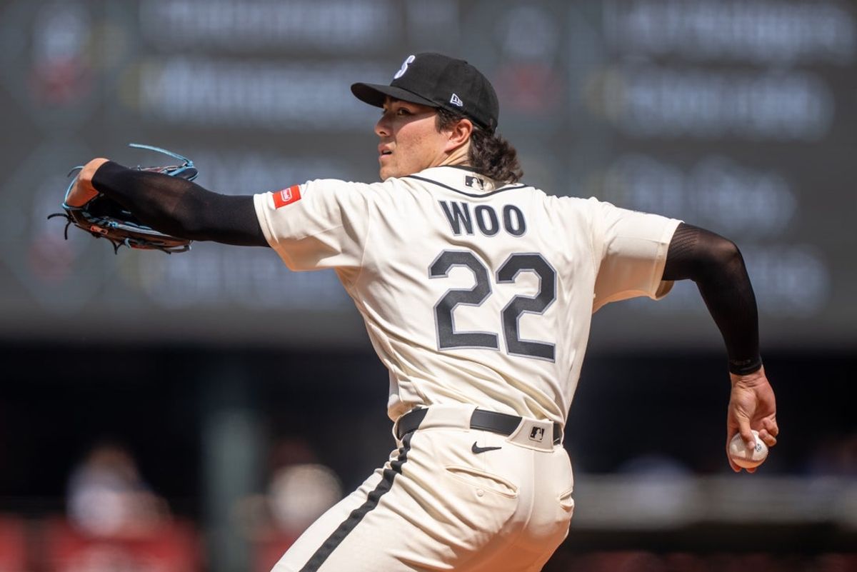 Apr 19, 2026; Seattle, Washington, USA; Seattle Mariners starter Bryan Woo (22) delivers a pitch during the first inning against the Texas Rangers at T-Mobile Park. Mandatory Credit: Stephen Brashear-Imagn Images