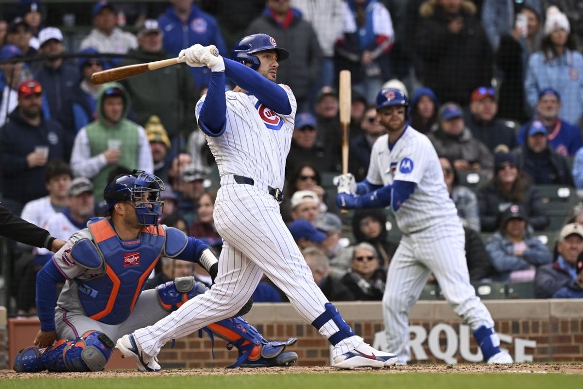 Apr 19, 2026; Chicago, Illinois, USA;  Chicago Cubs left fielder Michael Conforto (20) hits an RBI double against th New York Mets during the ninth inning at Wrigley Field. Mandatory Credit: Matt Marton-Imagn Images