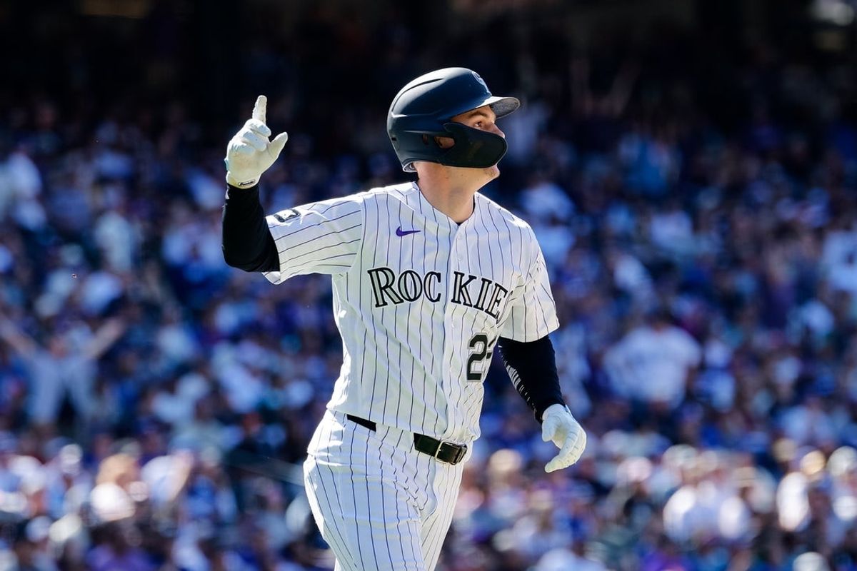 Apr 19, 2026; Denver, Colorado, USA; Colorado Rockies left fielder Mickey Moniak (22) gestures on a solo home run in the seventh inning against the Los Angeles Dodgers at Coors Field. Mandatory Credit: Isaiah J. Downing-Imagn Images