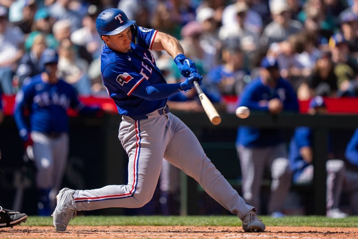 Apr 19, 2026; Seattle, Washington, USA; Texas Rangers left fielder Wyatt Langford (36) hits a single during the seventh inning against the Seattle Mariners at T-Mobile Park. Mandatory Credit: Stephen Brashear-Imagn Images
